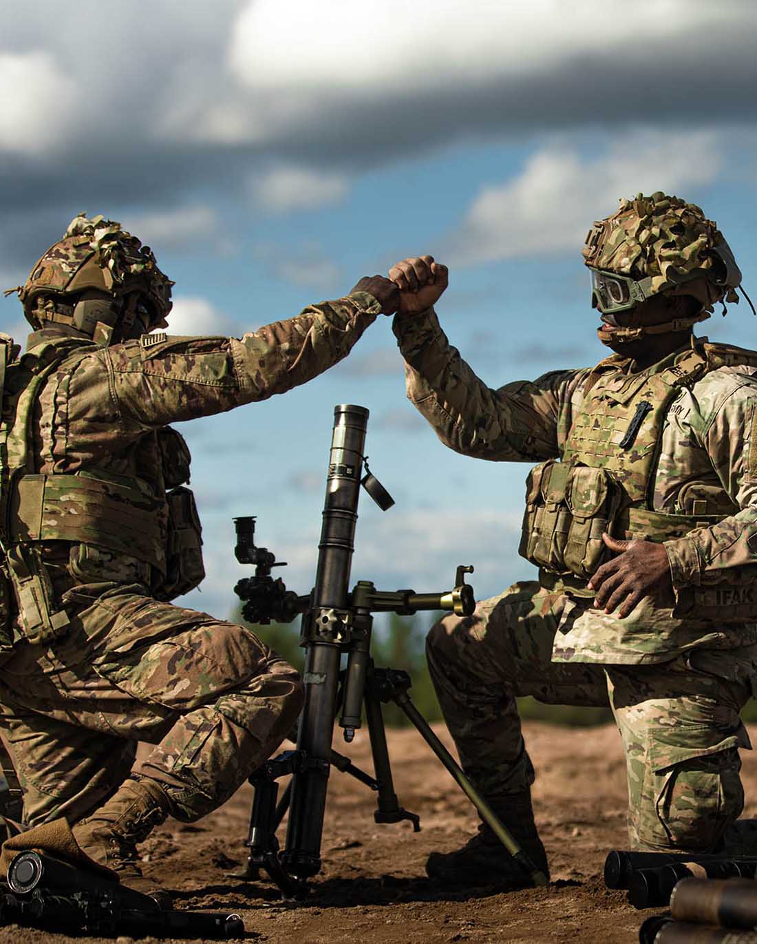 Two soldiers grasping hands